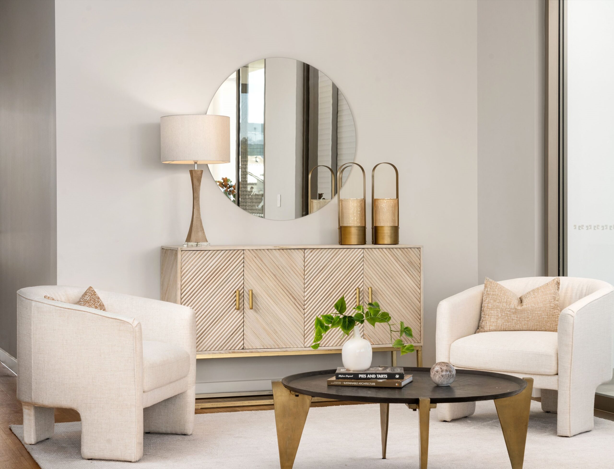A light modern sitting area with feature side unit and coffee table