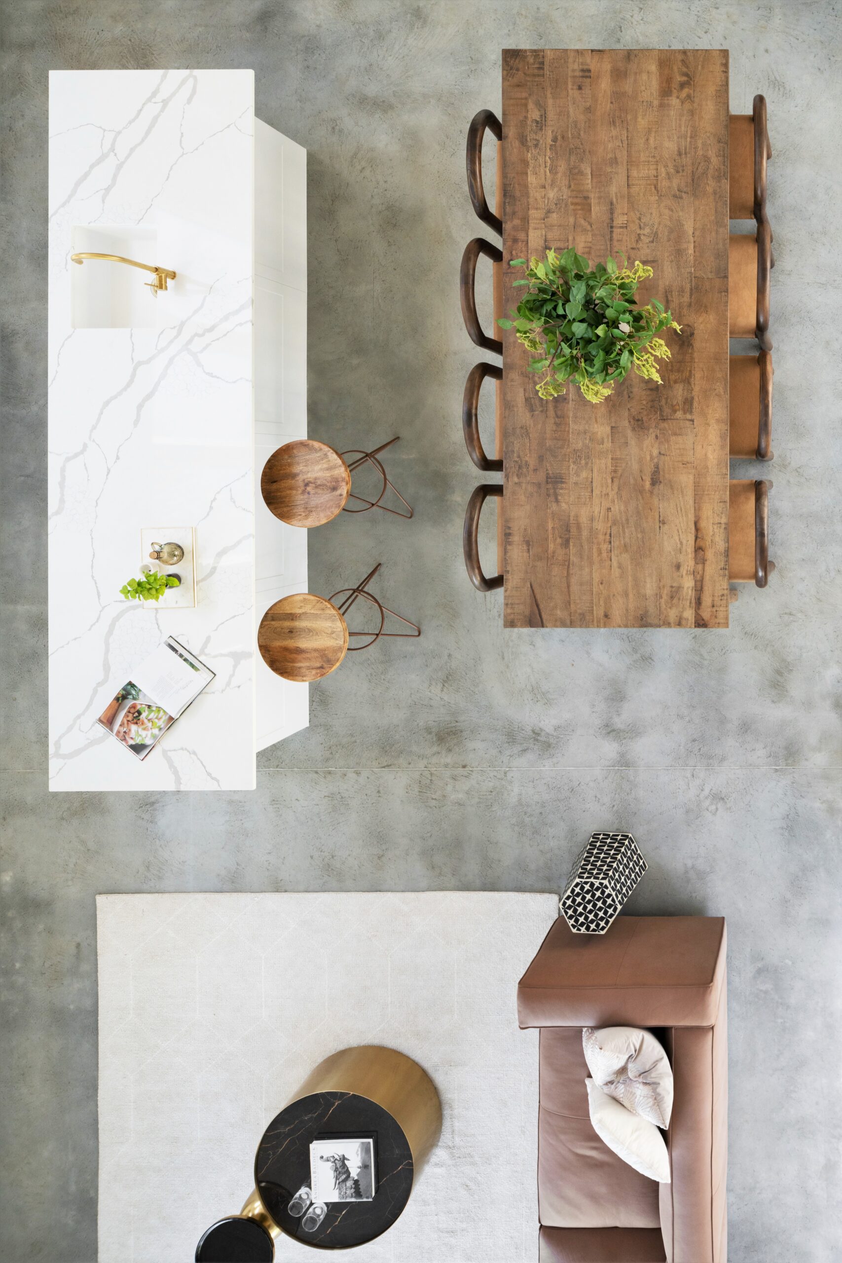 View of a dining area, kitchen island and living area from above