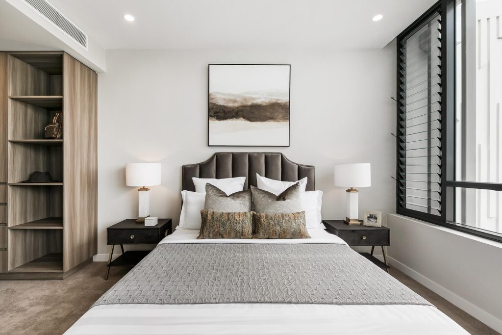 A modern bedroom with calming, neutral colours.
