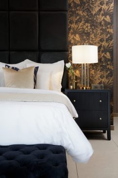 Bed and side table in a luxury bedroom