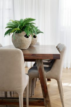 Dark wood dining table and cream chairs