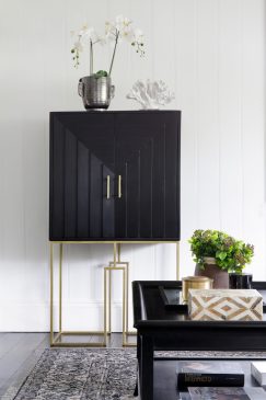 A modern black white and gold aesthetic furniture setup