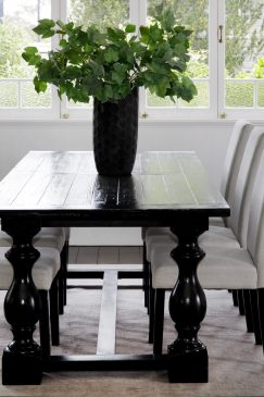 Bright white dining room with a dark wood table