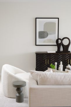 cosy natural coloured living area with dark wood side table